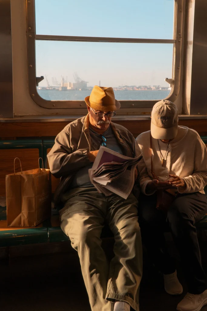 Elderly couple reading on a train